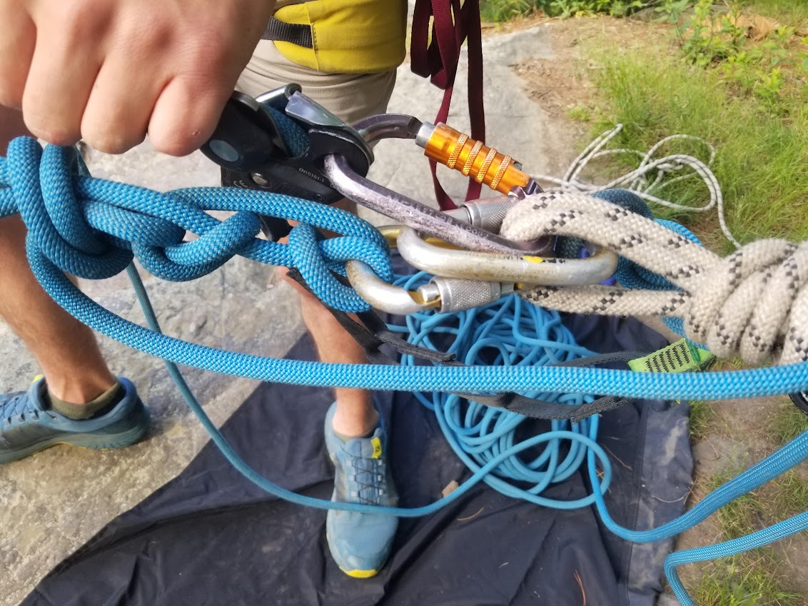 Guides and climbers at the base of a Devils Lake cliff
